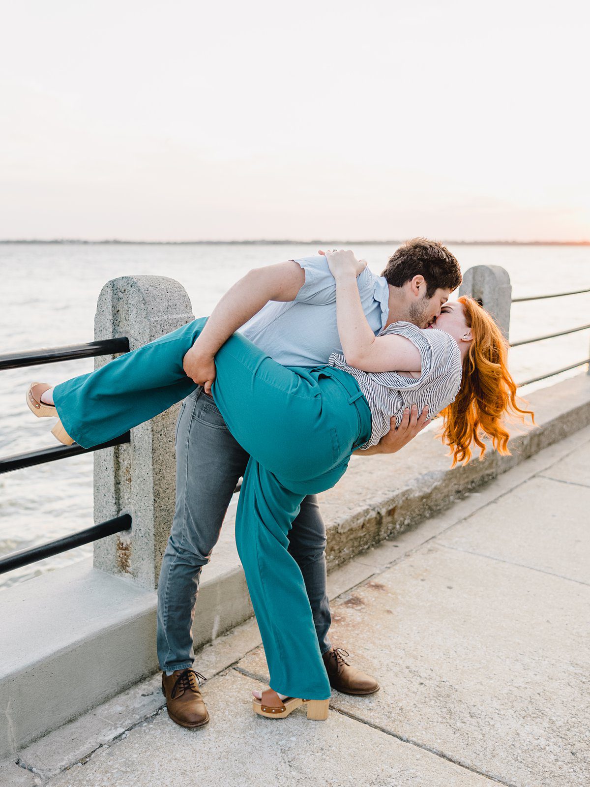 couple kissing at the waterfront in charleston south carolina