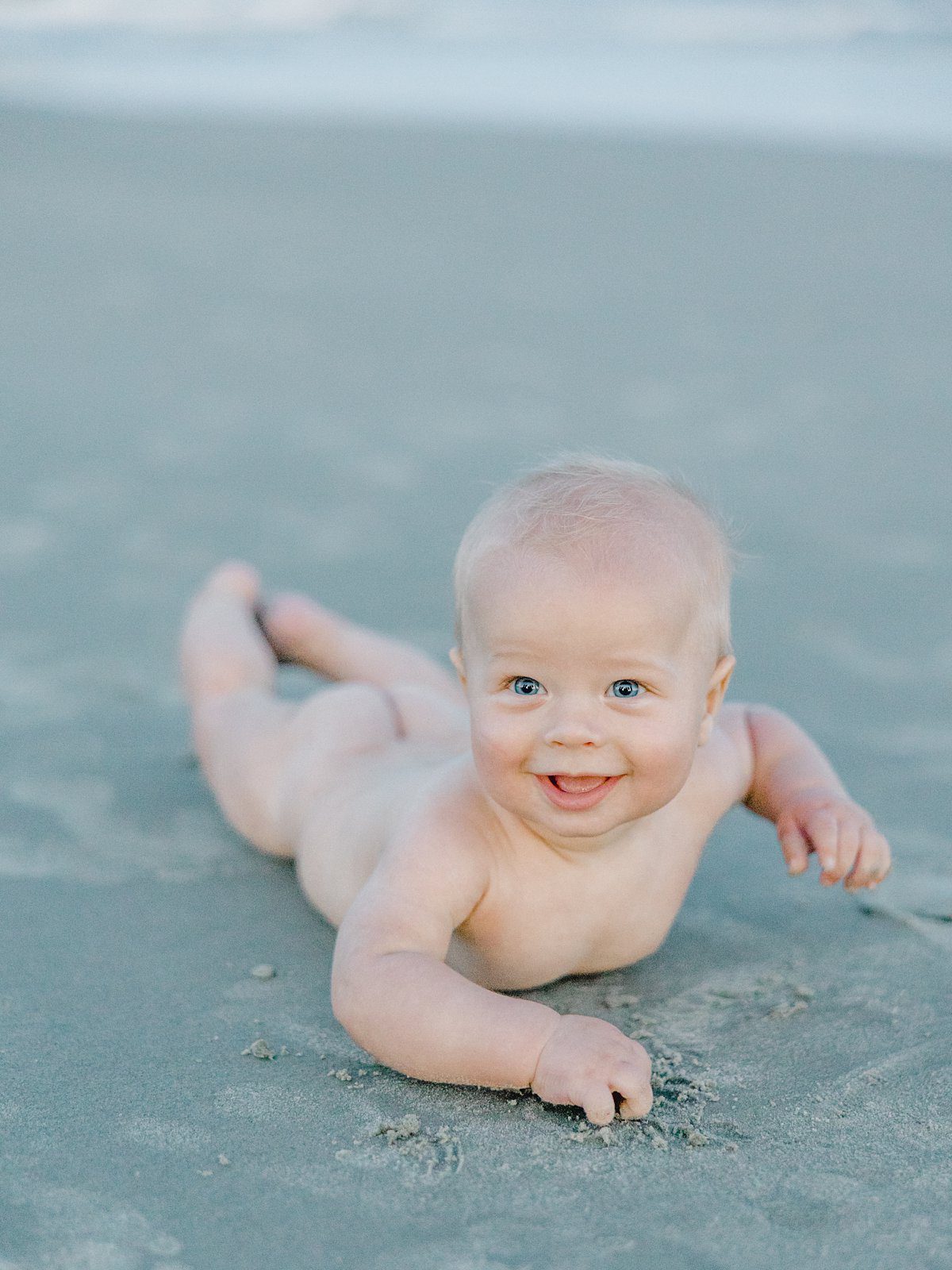 naked baby on the beach