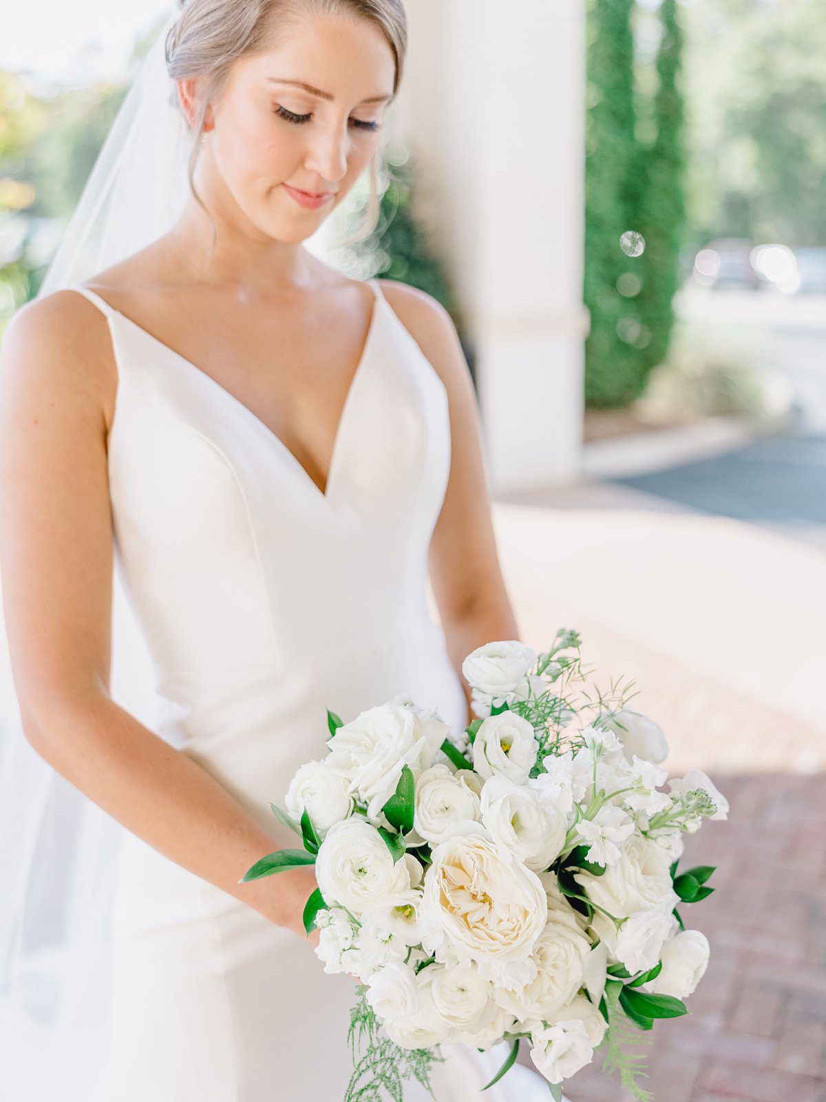 bride with white bouquet
