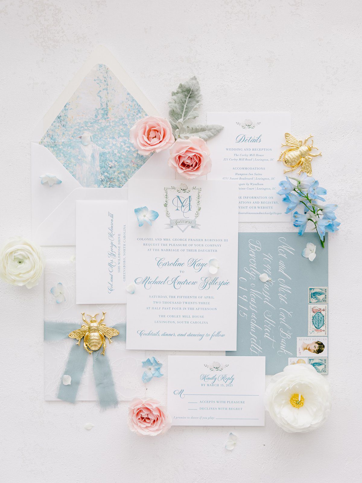 blue and white wedding invitation with pink flowers and gold bee accents