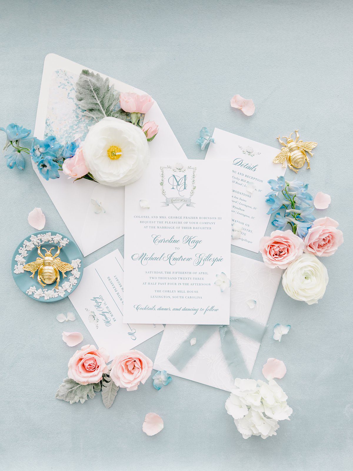 blue and pink wedding invitation flatlay