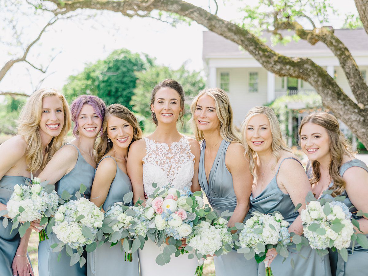 bridal party with bridesmaids wearing french blue silk gowns