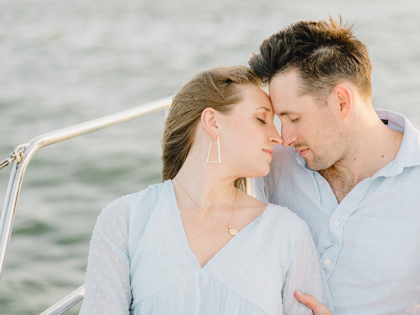 couple in a romantic pose on a sailboat