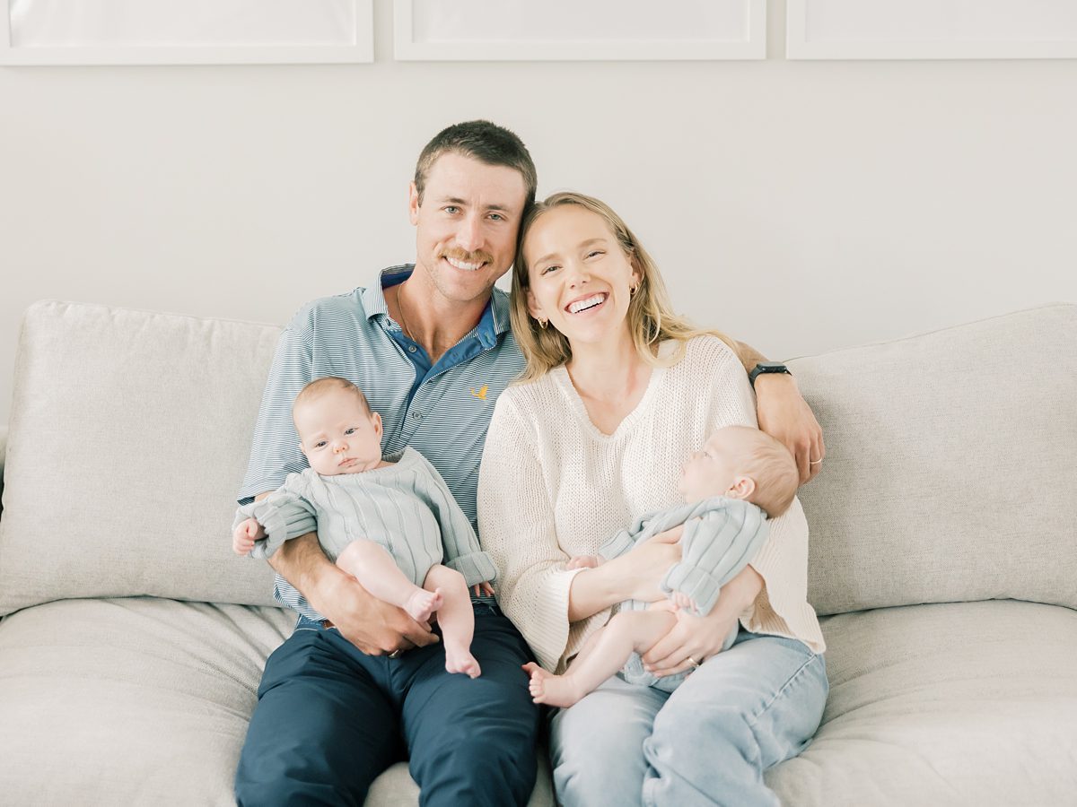 mom and dad hug at their in-home newborn session