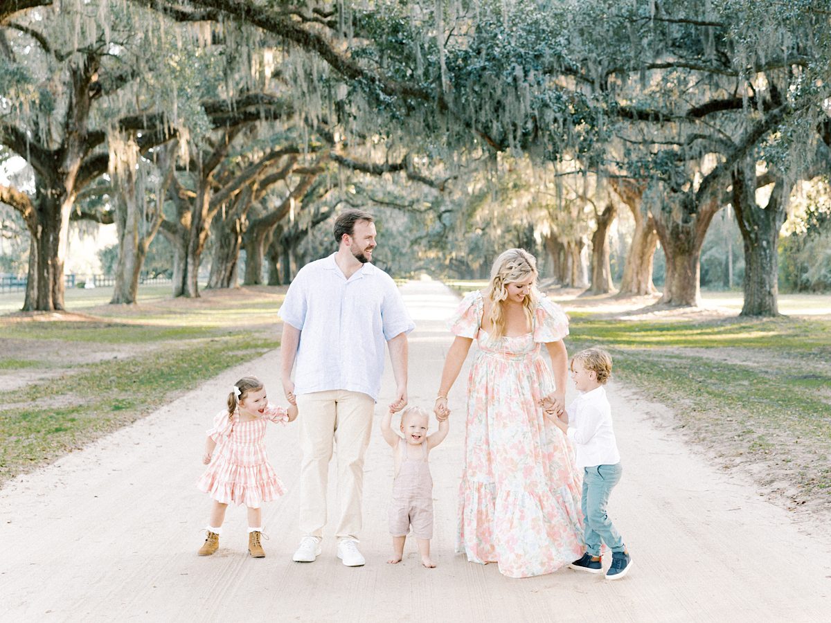 family walks together at charleston family session
